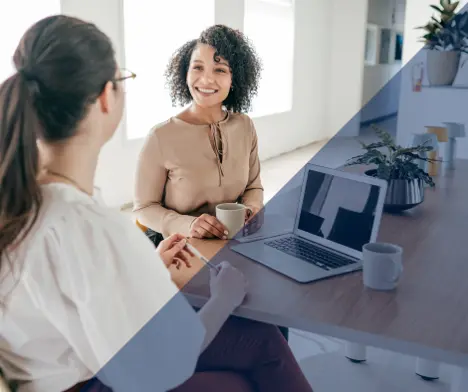 Two women having a discussion in an office